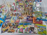 a lot of children ' s books and toys on a table