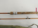 two fishing rods that are next to each other on the wall