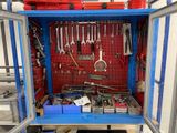 a blue cabinet with tools on it in a room