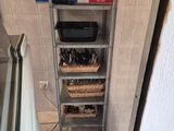 an image of a kitchen that has a shelf with tools on it