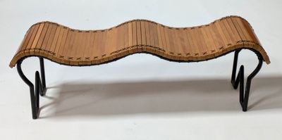 a wooden bench with black hairpin legs on a white background