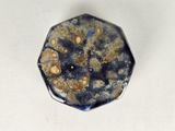 a picture of a blue and gold plate with a white background