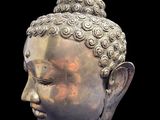 statue of a head of a person with a black background
