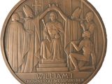 une image représentant une médaille de bronze sur laquelle figurent un homme et une femme
