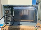 a microwave that is sitting on top of a box