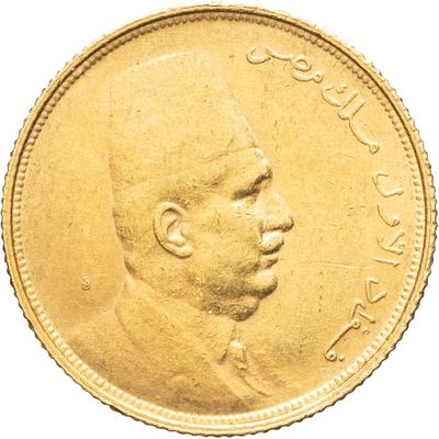 une image montrant un gros plan d'une pièce d'or sur laquelle figure le visage d'un homme