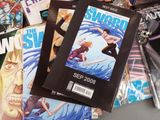 a lot of comic books that are on the table