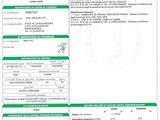 a green and white document with a barcode on it