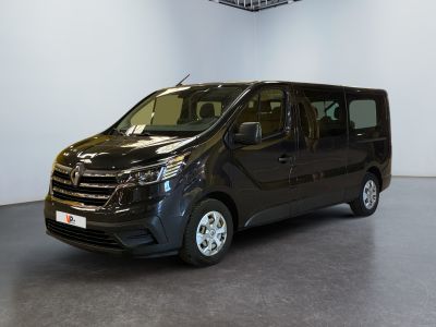 the black van is parked in a large room with a ceiling fan