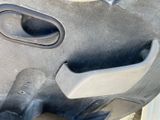 a close up of a car door handle with a hole in it