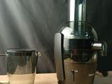 a blender and a glass on a table