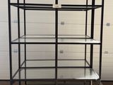 a close up of a metal shelf with glass shelves on top of it