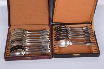 six spoons in a case that are sitting on a table