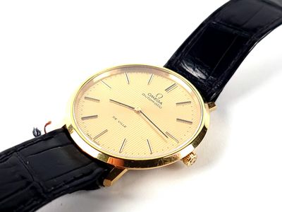 an image of a close up of a wrist watch on a white surface