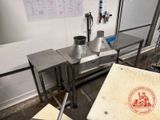 a table with a pizza box on it in a kitchen