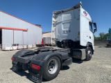a semi truck that is parked in a parking lot