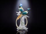 une figurine représentant deux oiseaux perchés sur une branche