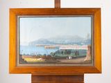 a picture of a painting hanging on a wooden easel