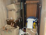 a small room with a lot of boxes and boxes on the floor