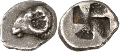 a close up of a coin with a cross on it