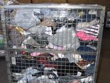 a metal cart with many items in it in a warehouse