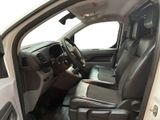 the interior of a white truck with leather seats and a steering wheel