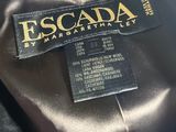 a close up of a black jacket with a black label on it