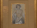 painting of a nude woman in a gold frame on a wall
