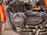 a close up of a motorcycle engine on a street