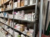 many boxes on the shelves in the warehouse