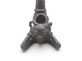 an image of a small metal object with a face on it