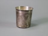 a silver cup that is sitting on a table