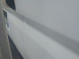 a close up of a white truck with a door handle