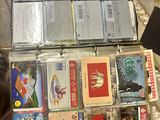 a suitcase full of cards and other items sitting on the floor