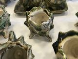 a lot of small teapots that are sitting on a table