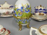 many different types of tea cups and saucers on the table