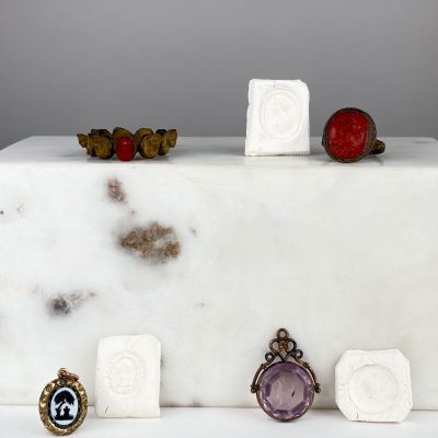 a white cake with a bunch of different rings on top of it