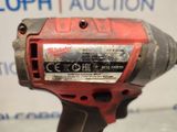 the cordless drill is red and has a black handle