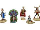 five figurines of different characters on a white background