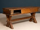 a wooden table with a drawer on top of it
