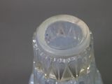 a close up of a bottle of water on a table