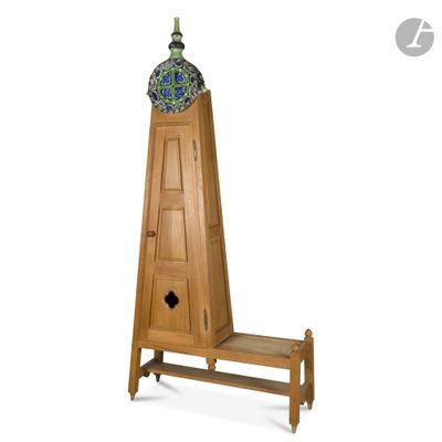a tall wooden clock tower with a blue and green vase on top of it