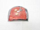 a piece of metal with a red design on it