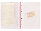 an open notebook with a pen and a piece of paper on it