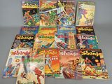 a bunch of comics are stacked on top of each other