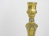 a gold candle that is sitting on a table