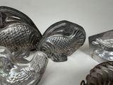 a lot of silver objects that are on a table