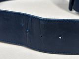 the blue leather belt has a metal buckle on it