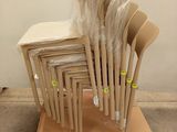 a lot of chairs stacked on top of a pallet