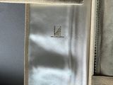 the inside of a white jacket with a zipper on it